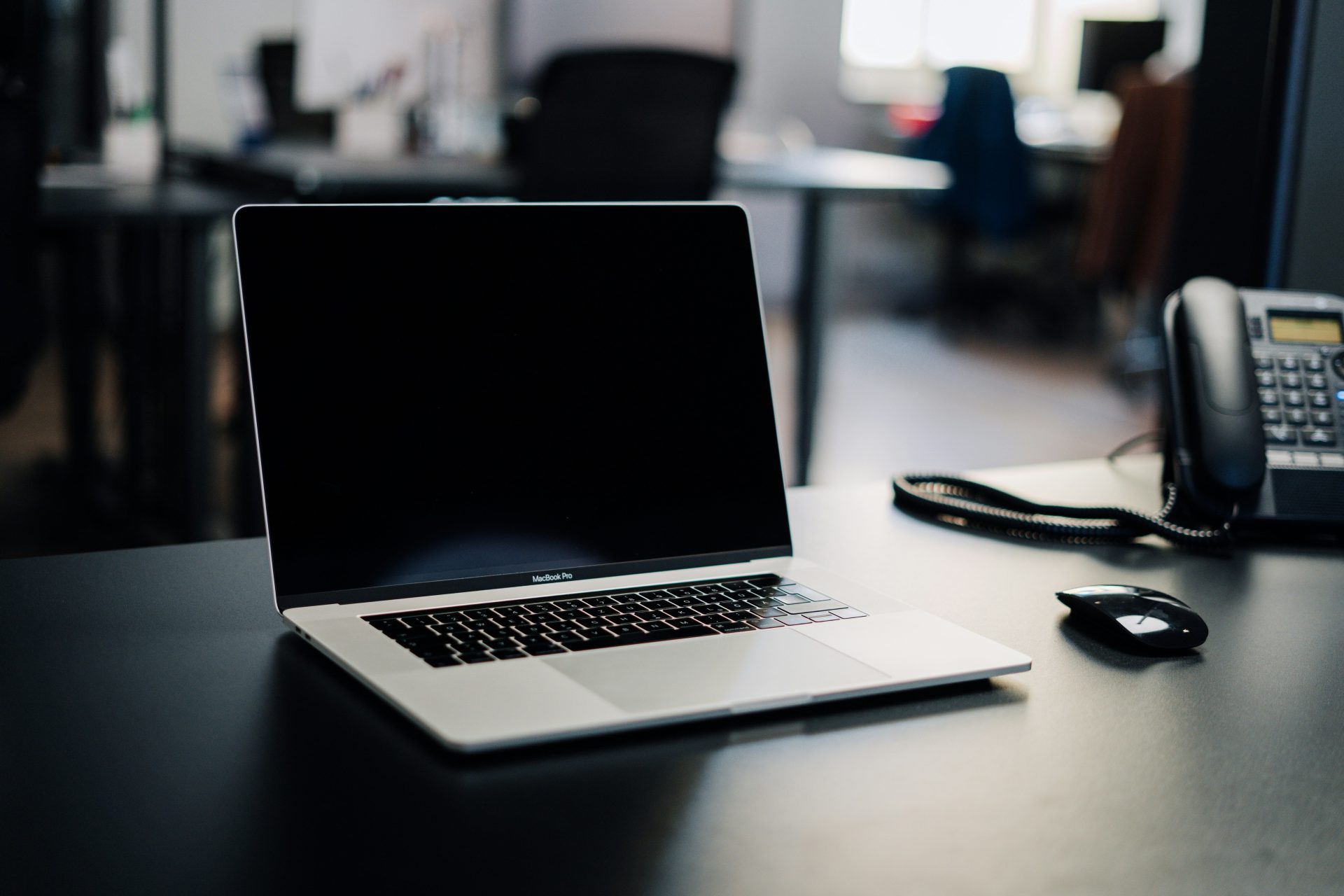 macbook pro on white table